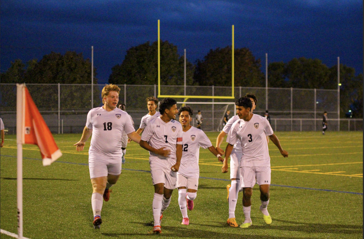 Seniors Bryce Bean, Marco Rojas Hernandez, Junior Brian Andrades Lara and Freshman Emanuel Marquez Hernandez celebrating Junior Sergio Marquez Hernandez goal against Shawnee Mission North West. 